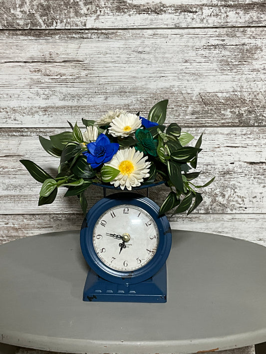 Cottage Clock Garden Arrangement - White Daisies & Blue Roses with Vintage Timepiece Base